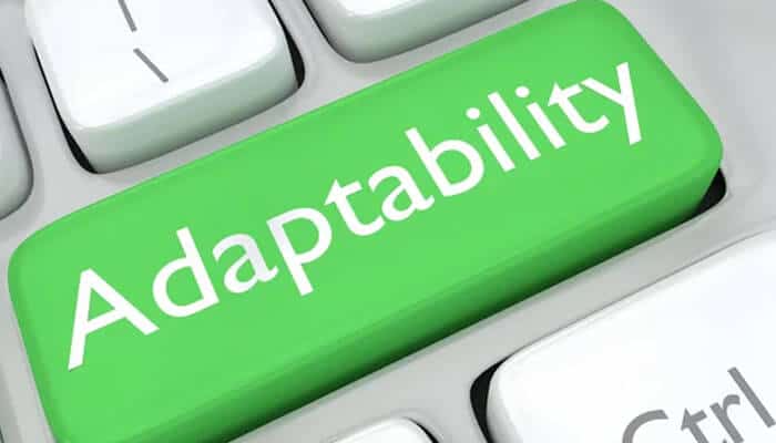 A close-up of a computer keyboard with a large green key labeled Adaptability, symbolizing leadership qualities such as flexibility and the ability to adjust to change