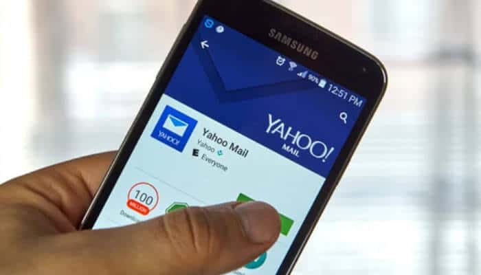 Person using a Samsung phone to open Yahoo Mail photos through the Yahoo Mail app