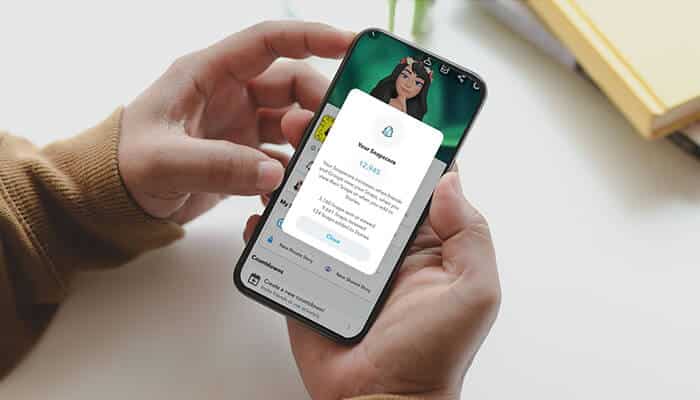 A person checking their Snap Score on Snapchat, showcasing how does Snap Score work on a smartphone, with the score displayed on the screen