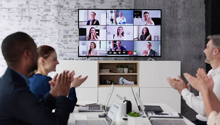Interactive Content Strategies displayed on a video conference screen, showcasing diverse participants actively engaging during a virtual meeting.