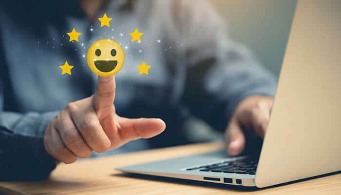 Customer satisfaction rating shown on laptop screen, highlighting benefits when businesses digitize scheduling for mobile field teams